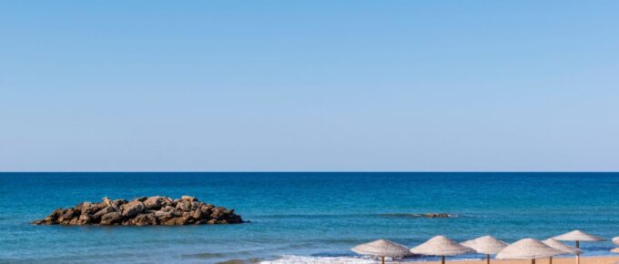 View of the deserted, sandy, windy beach on the western part of Corfu, the Chalikounas Beach.