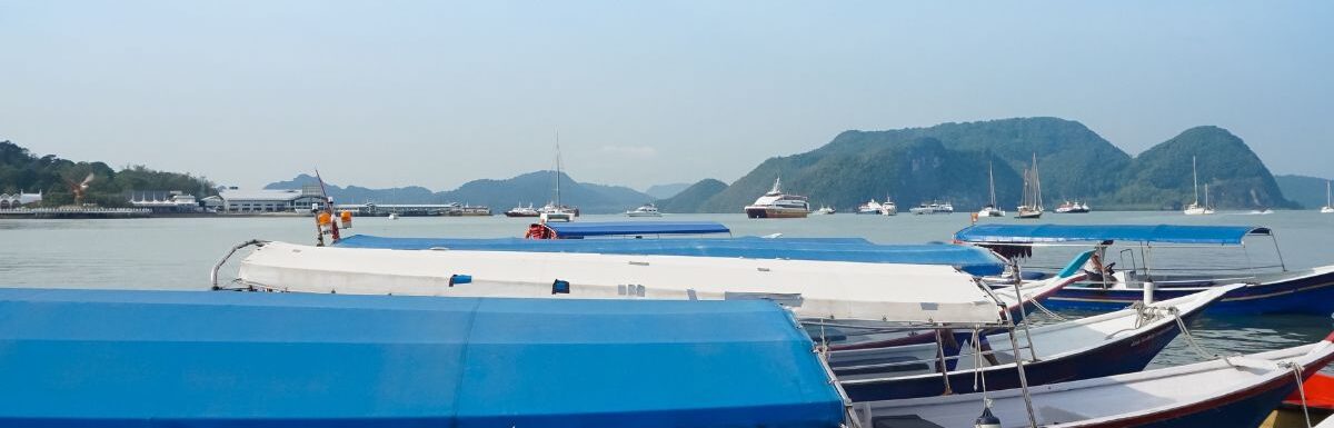 A group of people boards a boat for island hopping activity.