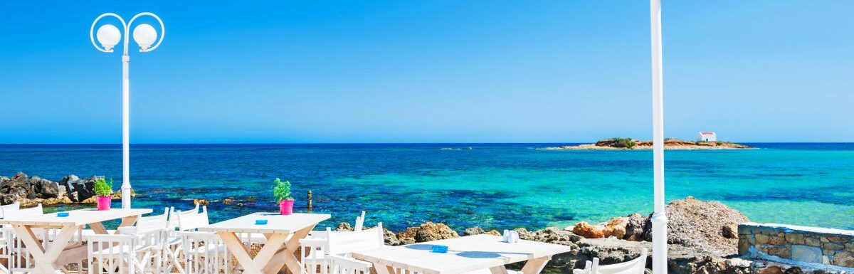 Beautiful tropical beach with turquoise water in Malia, Crete island, Greece.
