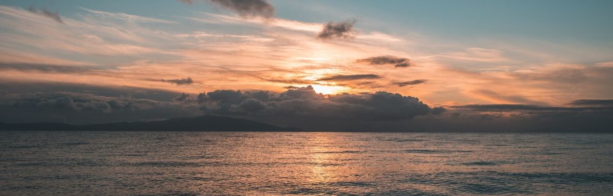 A cloudy sunrise over the sea at Lesvos, Greece.