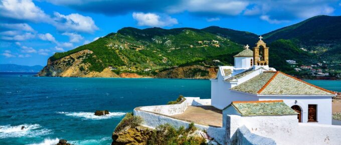 View of Panagitsa Tou Pirgou church over the bay, Skopelos, Greece.