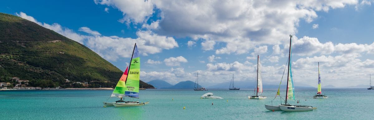 Sailing boats in Vasiliki Bay, Lefkada, Greece on a hot summer day.