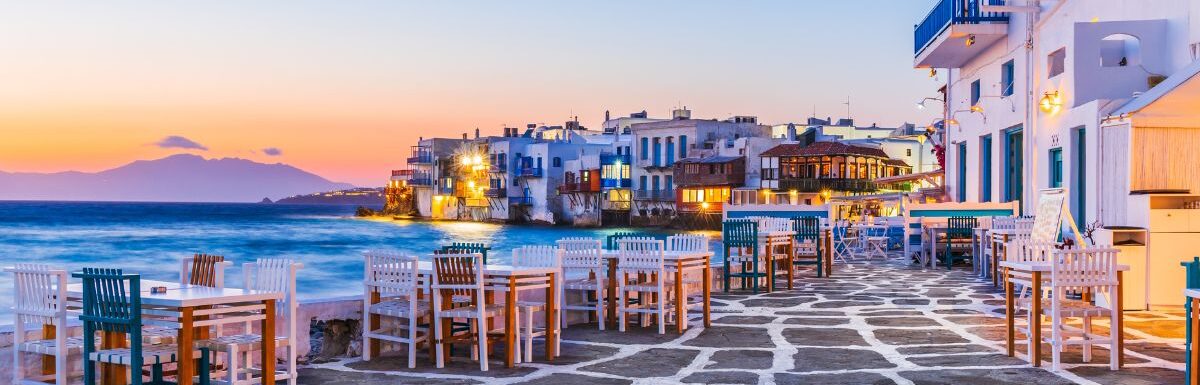 Waterfront in Little Venice, Mykonos at sunset.