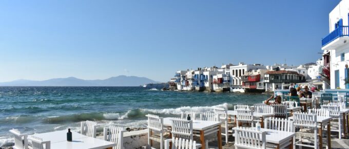 Waterfront in Little Venice Mykonos Chora with restaurants and tourists, Mykonos island, Mikonos, Cyclades islands, Aegean sea, Greece in July.