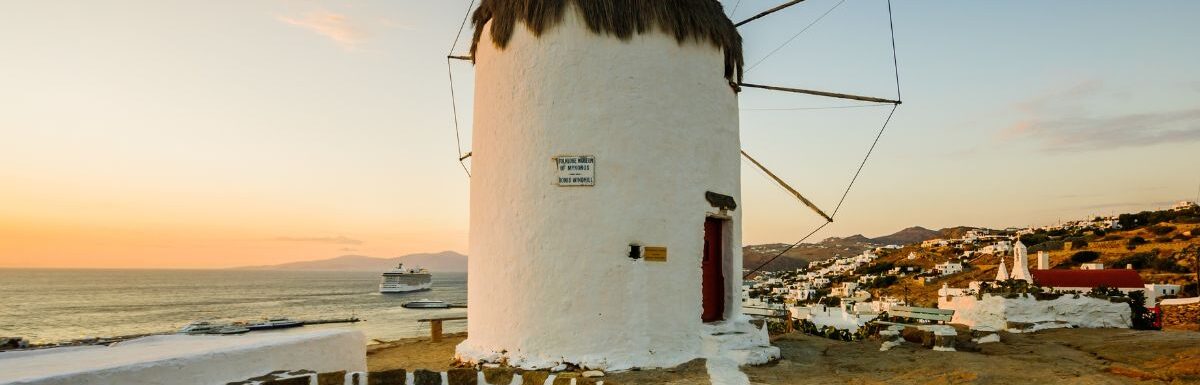 Sunset view of an old windmill, in Mykonos, Mykonos Island, Greece.
