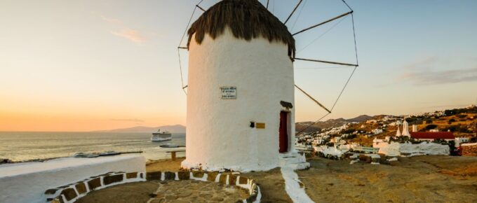 Sunset view of an old windmill, in Mykonos, Mykonos Island, Greece.