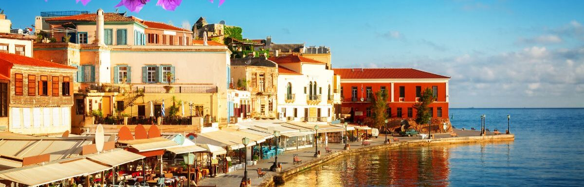 Bay of Chania at sunny summer day, Crete Greece with flowers.