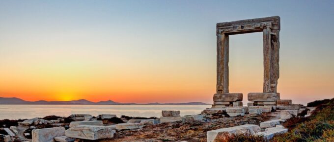 The sunset from Portara in Chora of Naxos island, Greece.
