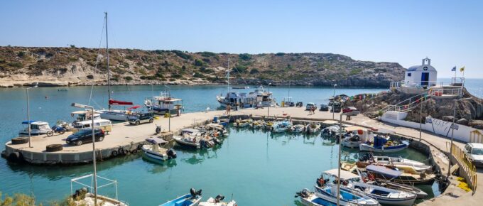 Sea bay with moored boats in Kolymbia harbor, in Rhodes, Greece.