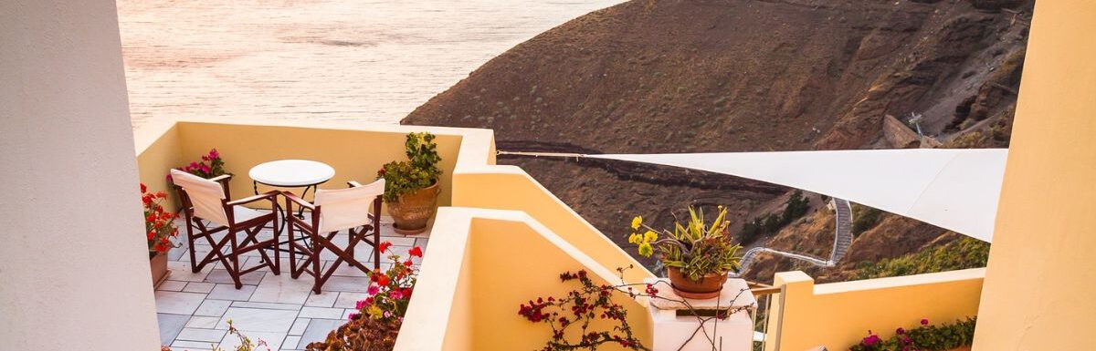 A house near a body of water in Fira, Thera, Greece.