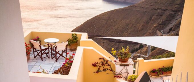 A house near a body of water in Fira, Thera, Greece.