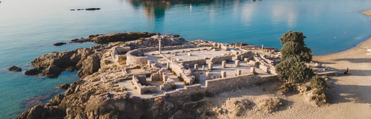 An aerial view of the ancient Agios Stefanos Basilica in the foreground in Kos, Greece.