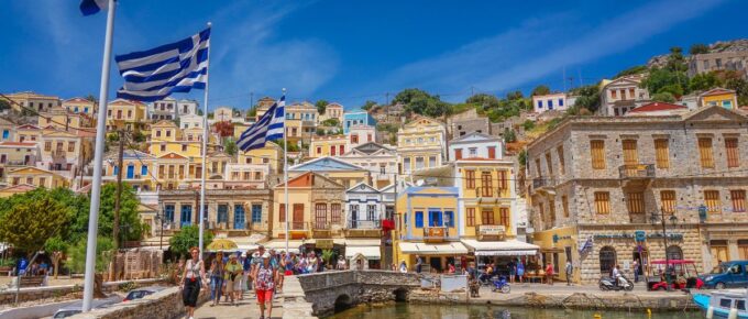 Scenic view with beautiful traditional houses and colorful buildings at the port of Symi island near Rhodes, Greece.